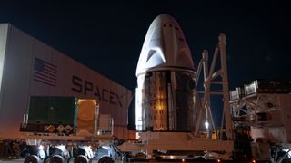 The SpaceX Crew Dragon capsule for the private Polaris Dawn mission arrives at its rocket hangar.